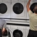 People using laundry machines